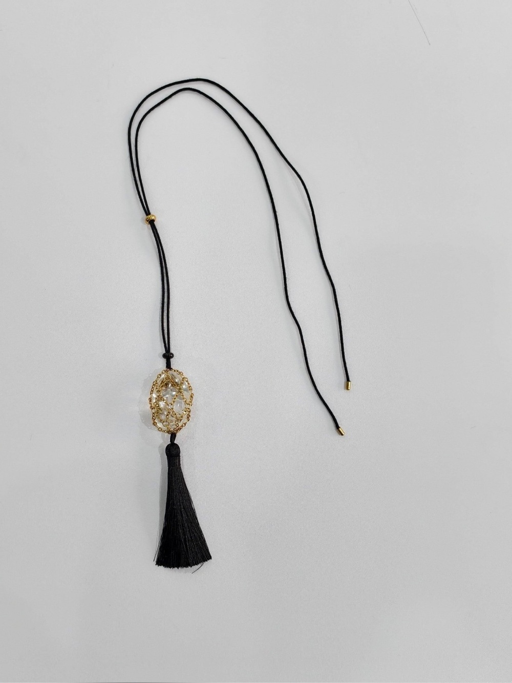 New MAYAMAR black tassel with gold and crystal pendant